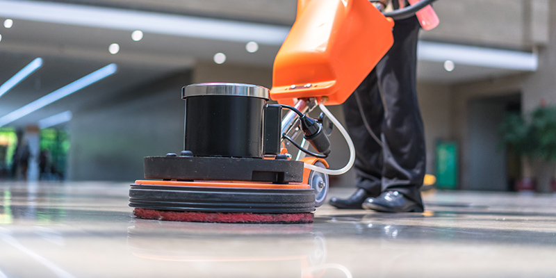 cleaning floor with machine